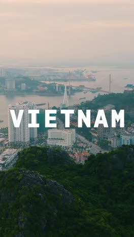 Vertical-Video-Drone-Shot-Of-Vietnamese-Coastal-Port-City-Scene-Overlaid-With-Animated-Graphic-Spelling-Out-Vietnam