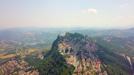 picturesque view of san marino town with guaita tower on the slopes of monte titano in southern europe. - aerial
