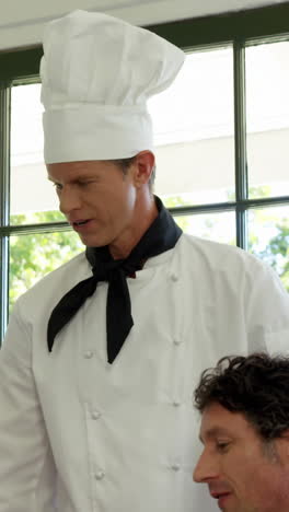 chef explaining the dish to a couple