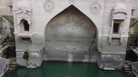 ancient-red-stone-unique-stepwell-architecture-at-day-from-different-angle-angle-video-is-taken-at-Toorji-ka-Jhalra-or-stepwell-jodhpur-rajasthan-india