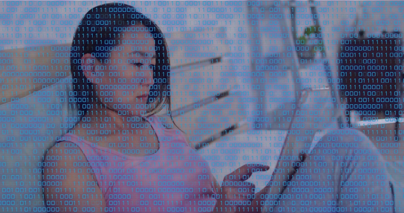 Mid adult woman reclining on bed cradling tablet and swiping then tapping content for tech research