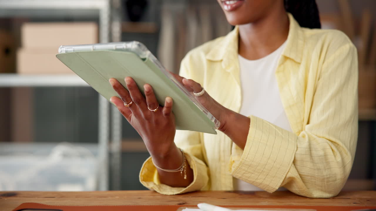 African American Woman Using a Digital Tablet for Work