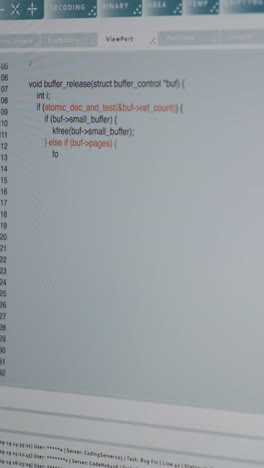 vertical video close up of code being typed on pc screen by admin developing software