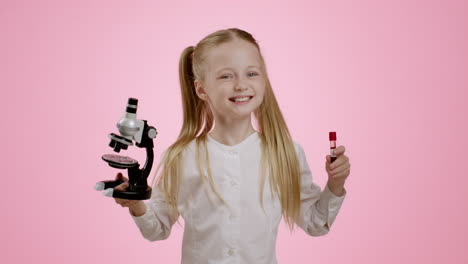 child playing with microscope and lipstick