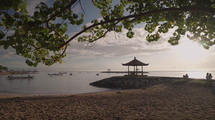 Sunrise at a Balinese Beach with a traditional gazebo