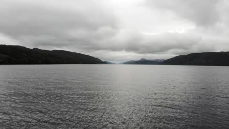 Aerial-Flying-Over-Waters-Of-Loch-Ness-With-Clouds-Overhead