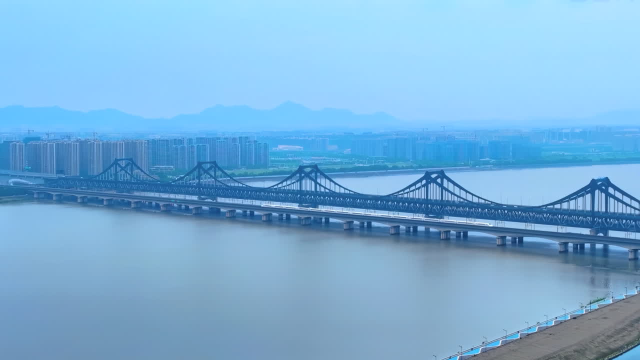 Long Bridge Over River in City