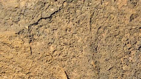 HD-Hawaii-Kauai-slow-motion-medium-shot-'aerial'-looking-straight-down-trucking-in-above-lava-rocks