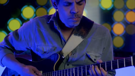 Close-Up-Shot-Of-Musician-Playing-Guitar-With-Confidence