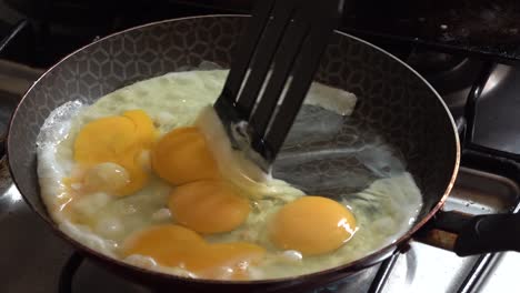 cooking eggs on a pan