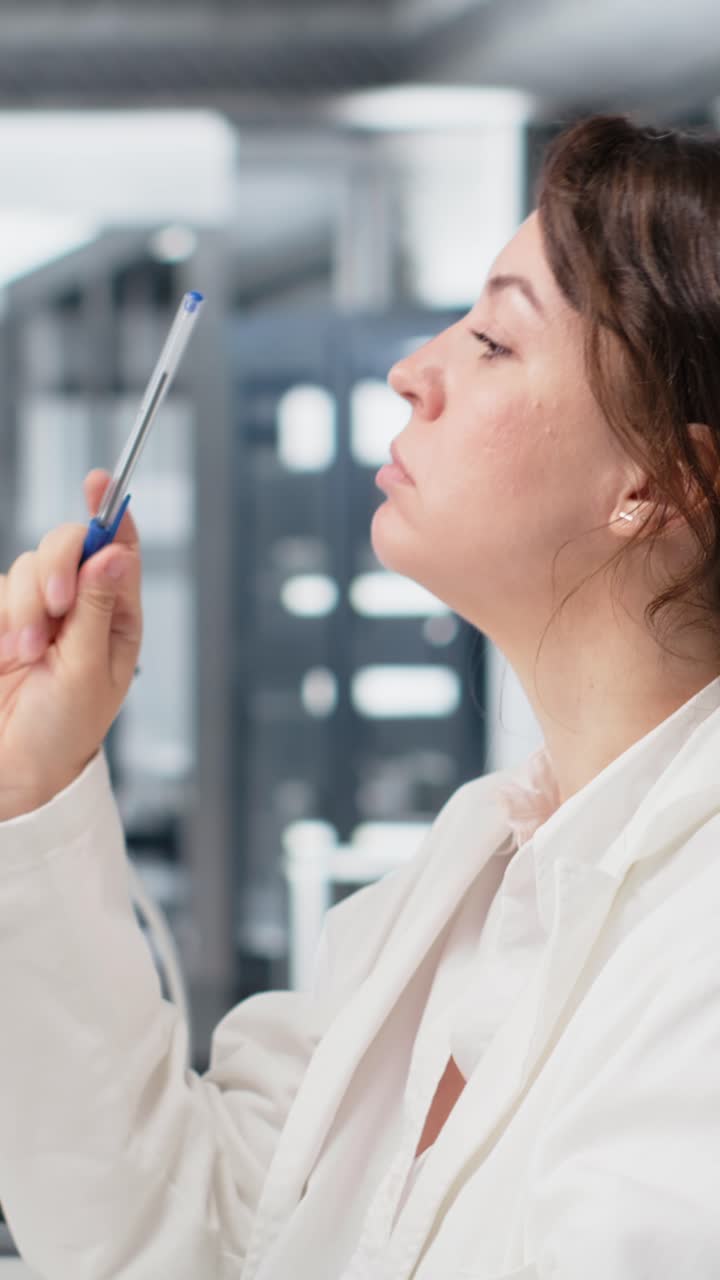 Vertical video Nanotechnology researcher thinking how to prevent diseases