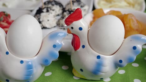 breakfast with eggs in decorative eggcups