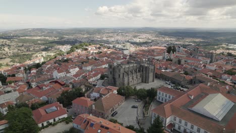 aerial half orbit guarda downtown with majestic ancient cathedral, portuguese cityscape