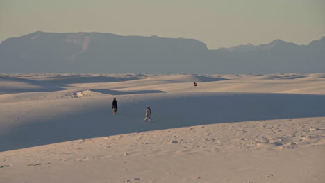 visitors walk through sand dunes at white sands national park new mexico, 4k