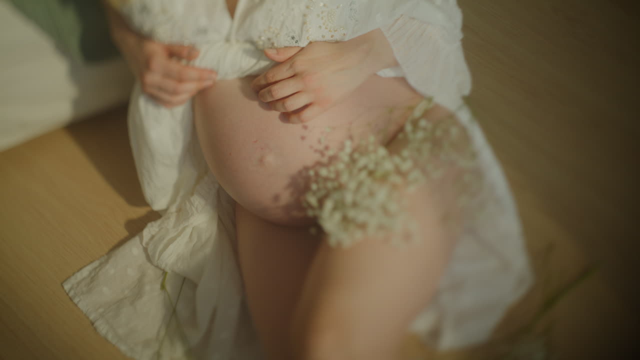 Closeup of Pregnant Woman's Belly in Sensual Portrait