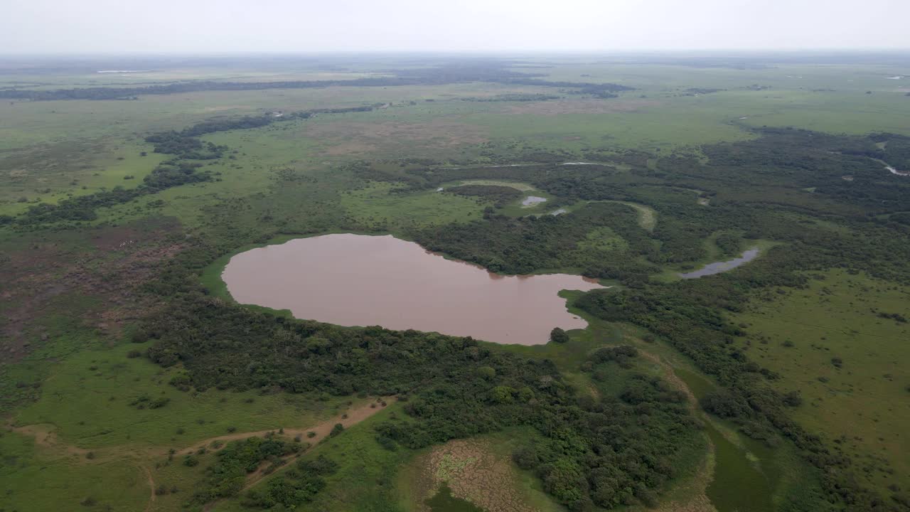 Expansive aerial of Bolivia Rio Yacuma, capturing the lush greenery and winding river