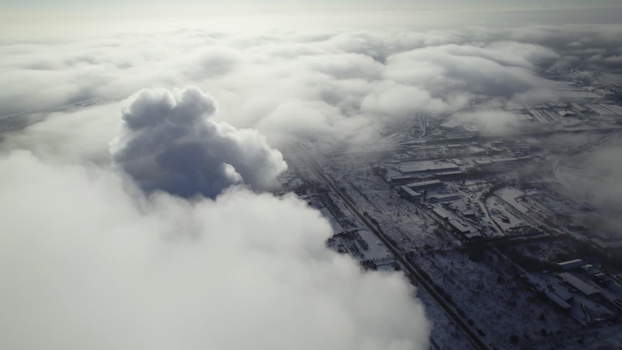 Industrial Area Covered in Fog and Clouds, Aerial View in Winter