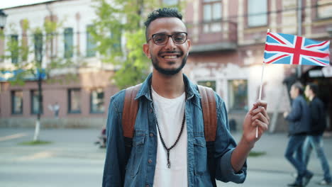 smiling tourist with british flag