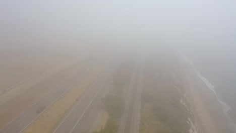 Aerial-Over-A-Foggy-Freeway-Us-101-Pacific-Coast-Highway-With-Traffic-Along-The-Coast-Of-California-2