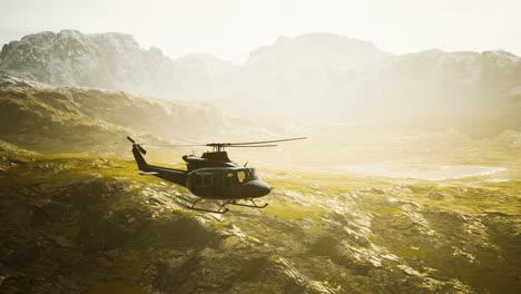 slow motion vietnam war era helicopter in mountains