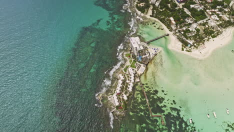 isla mujeres mexico aerial v8 cinematic birds eye view flyover mia reef capturing beautiful island resorts, playa norte beach and crystal clear water from above - shot with mavic 3 cine - july 2022