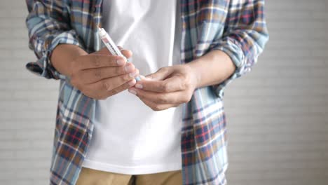 person using an insulin pen