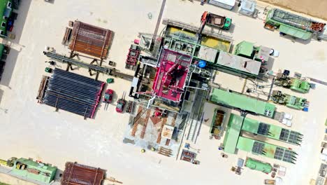 Top-Down-View-Of-Oil-And-Gas-Drilling-Rig---aerial-orbit