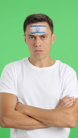 dignified and serious man with israeli flag painted on face