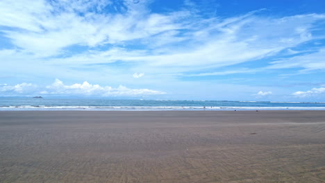 empty remote tropical beach at the pacific coastline in nature reserve in costa rica