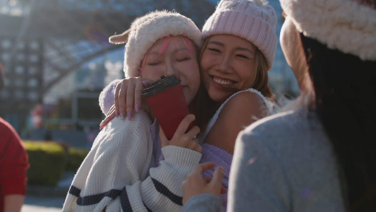 Friends enjoying coffee on a sunny winter day