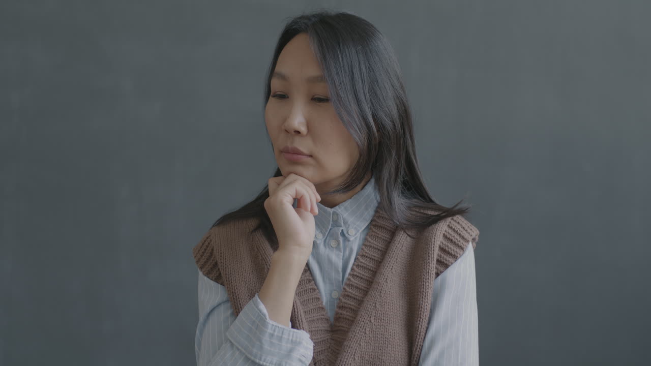 Thoughtful Asian Woman