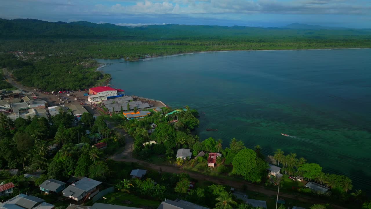 Wewak costal town Dogreto Bay aerial drone Wewak Hill Papua New Guinea PNG East Sepik Region Province Sundaun Market Boram road Bismarck Sea summer sunny morning dry season cycle forward pan up motion