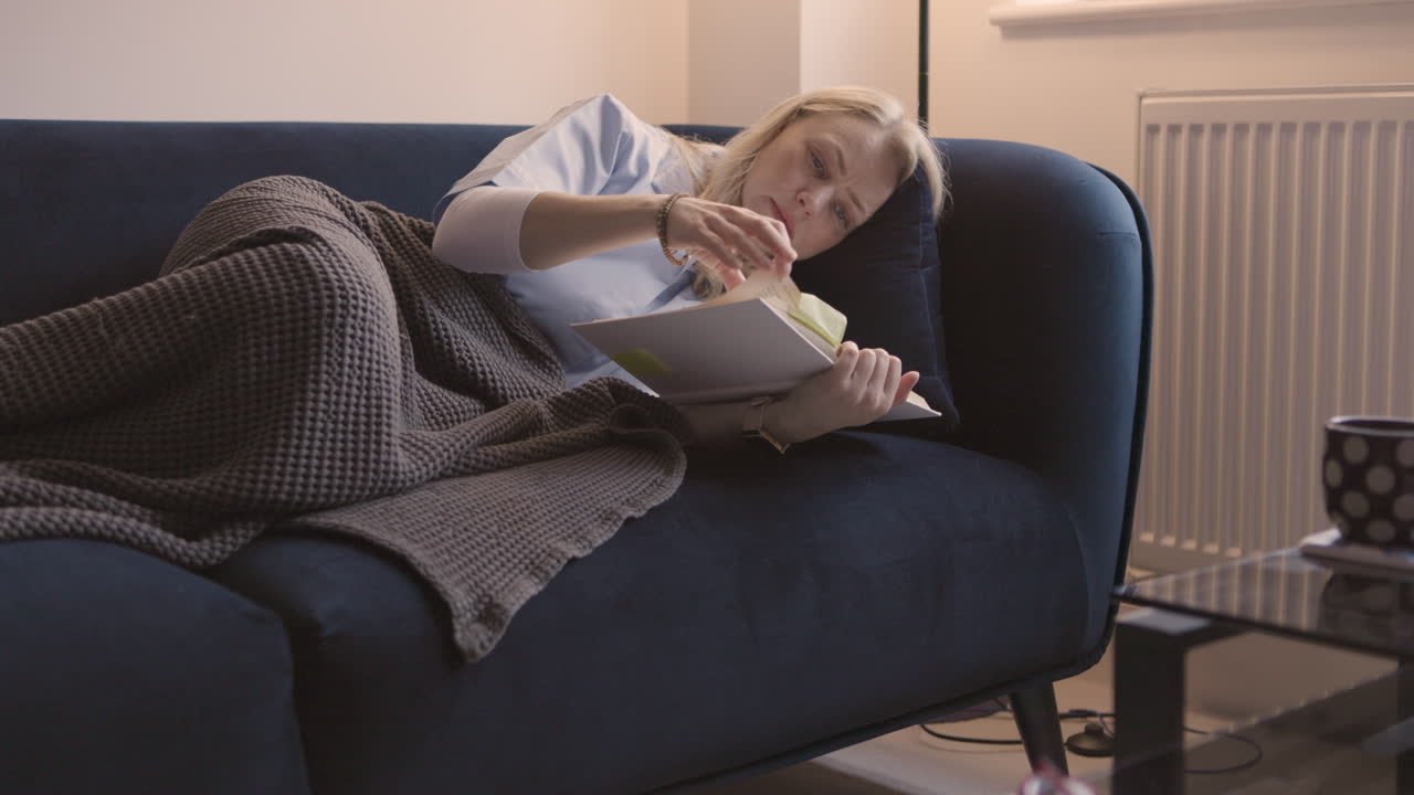 Woman Reading on Couch