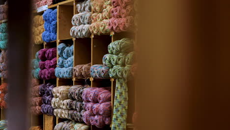 Colorful-display-of-yarn-in-shelves-at-fabric-store