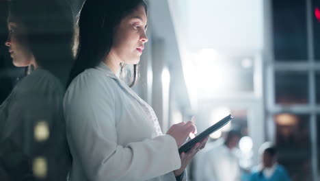 Doctor,-woman-and-research-information-on-tablet