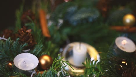 a burning candle was blown out of a christmas wreath