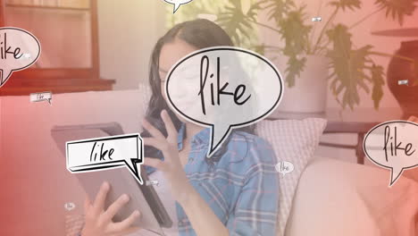 using tablet, woman surrounded by animated speech bubbles