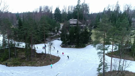 skating in a park along flooded, frozen walkways or a pond or river - ascending aerial view