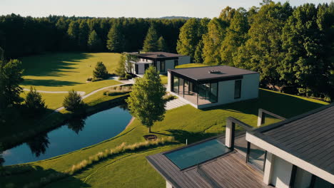 couple enjoys outdoor dining on patio of a modern luxury home with a scenic landscape