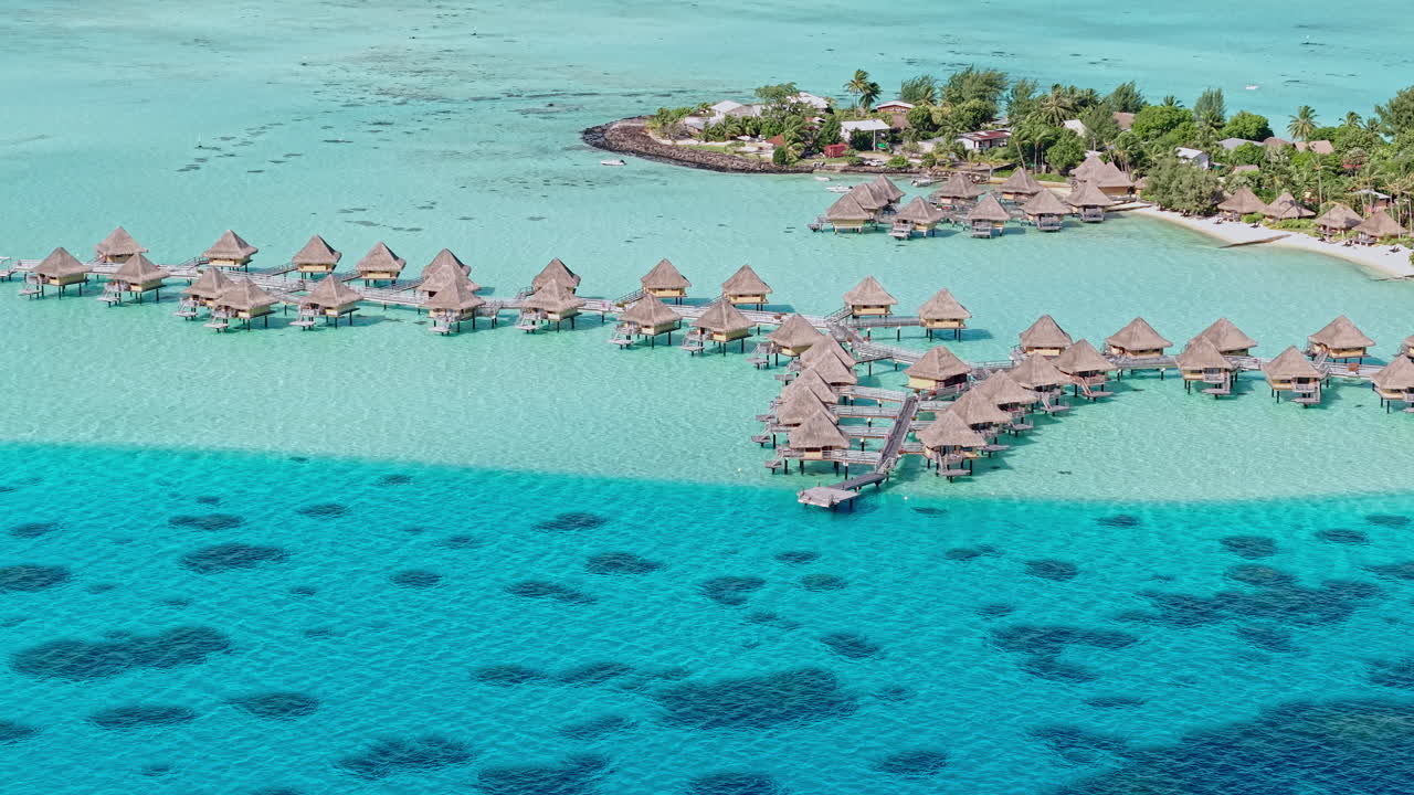 Bora Bora Island, French Polynesia. Drone Shot of Overwater Villas of Luxury Resort and Lagoon