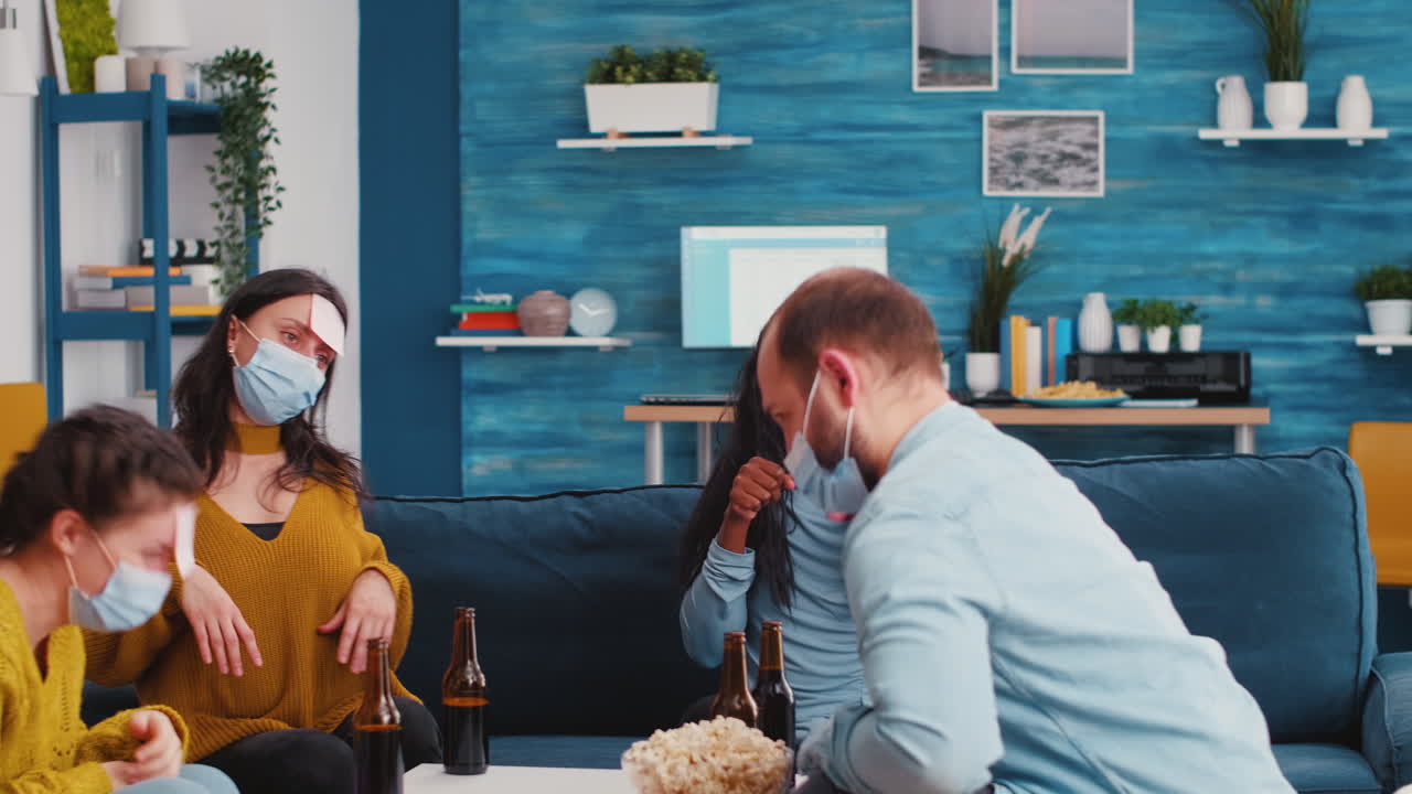 Multiracial colleagues with protective masks playing game with sticky notes