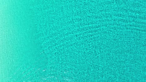 aerial view above shallow, turquoise waters of cancun, mexico - cenital, drone shot