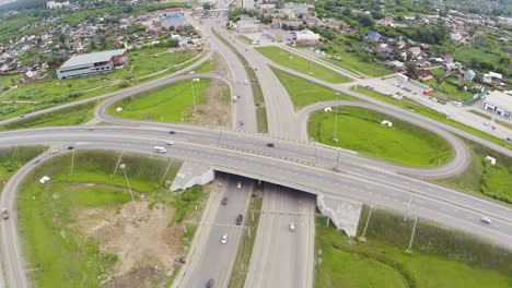 aerial view of highway interchange and cityscape