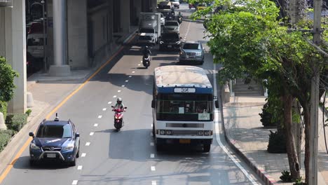 vehicles moving through a city street intersection