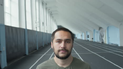 portrait of male athlete in stadium