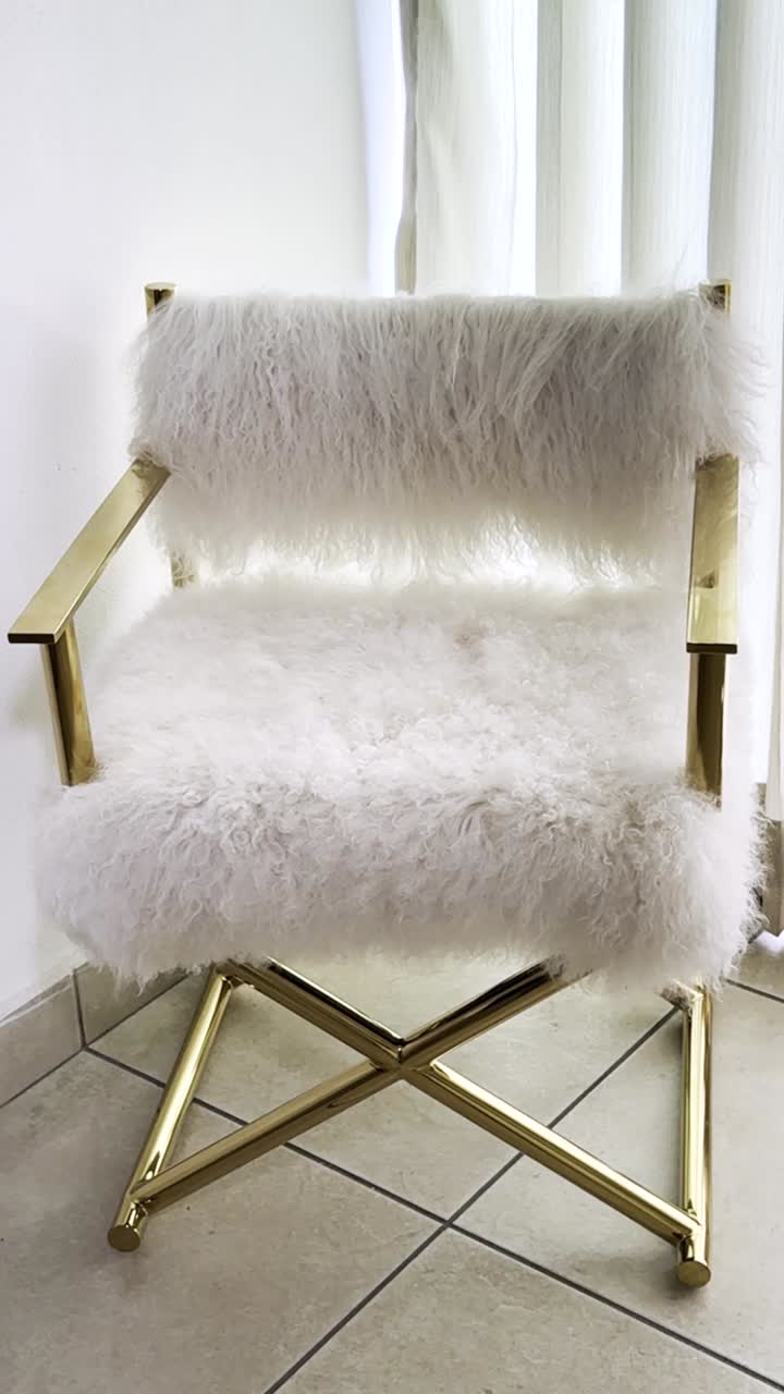 Elegant gold chair with white plush. Vertical shot