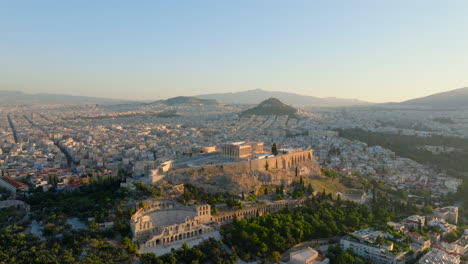 rising aerial shot of the acropolis at sunrise