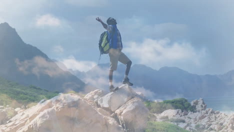 man raising arms on coastal peak for travel campaign, showing animated compass and elevation chart