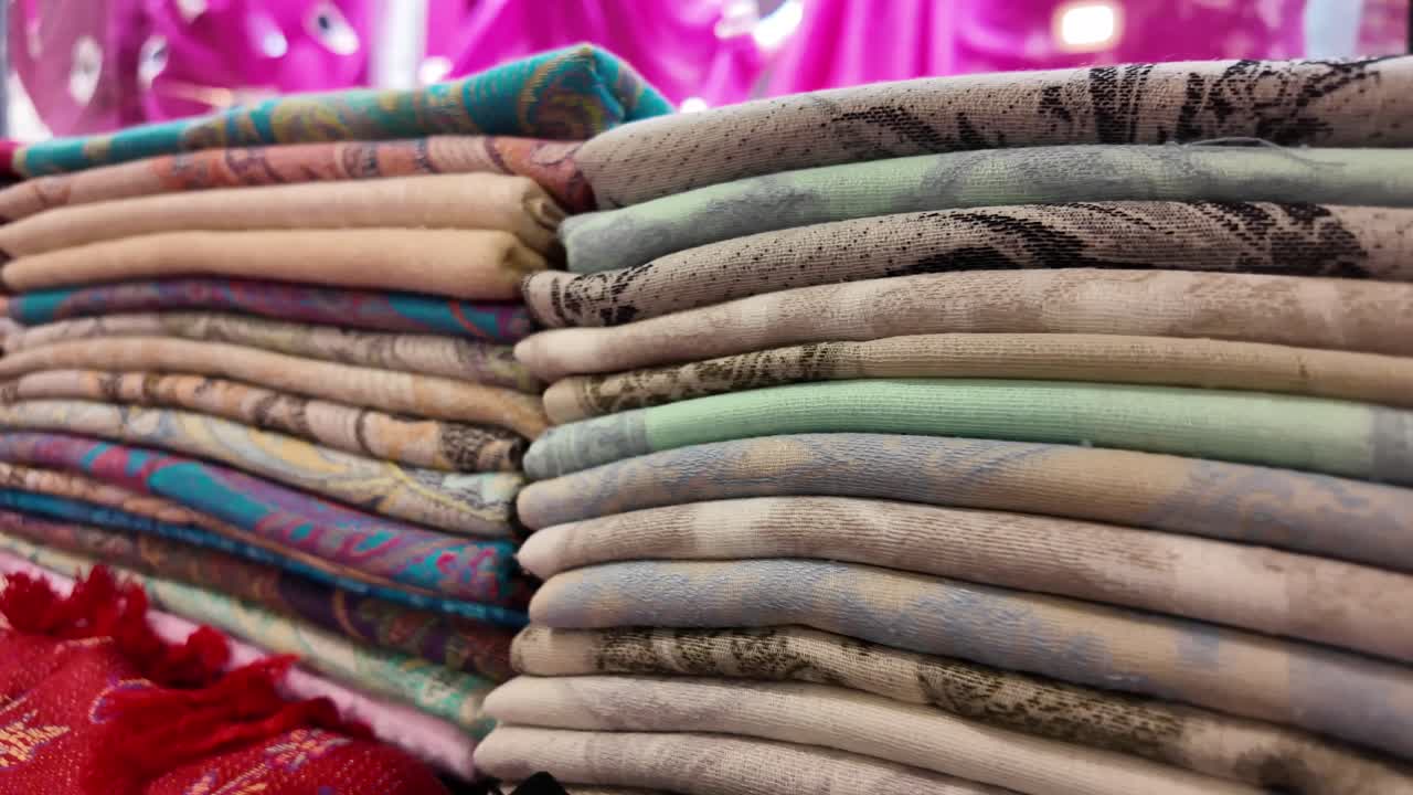 Stacks of colorful scarves