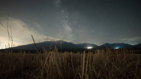 Timelapse-Milky-way-over-Mountain-Olympus-Greece-wheat-foreground-wide-shot